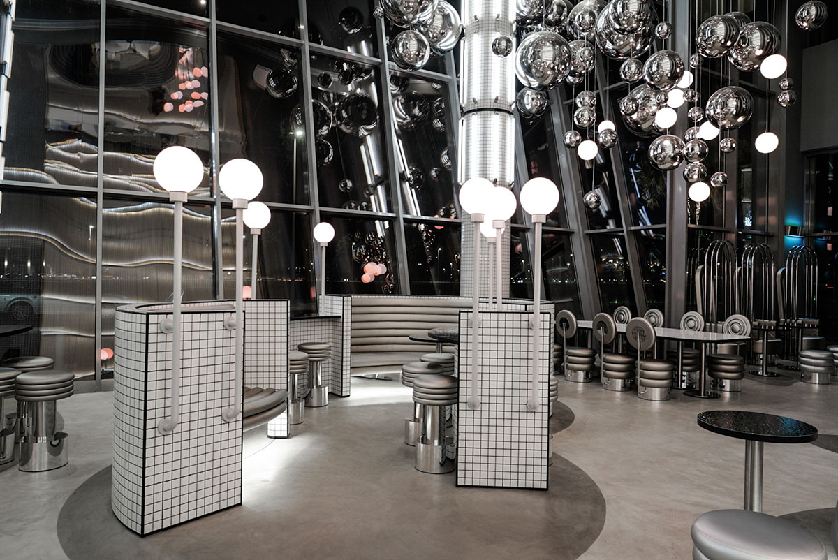 Masquespacio creates metallic interiors and water-inspired spaces for bakery in Saudi Arabia 