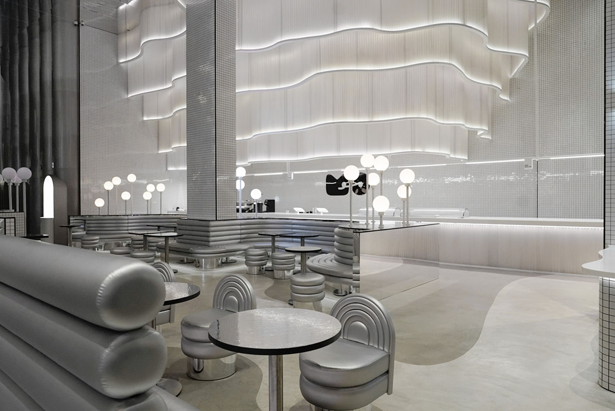 Masquespacio creates metallic interiors and water-inspired spaces for bakery in Saudi Arabia 