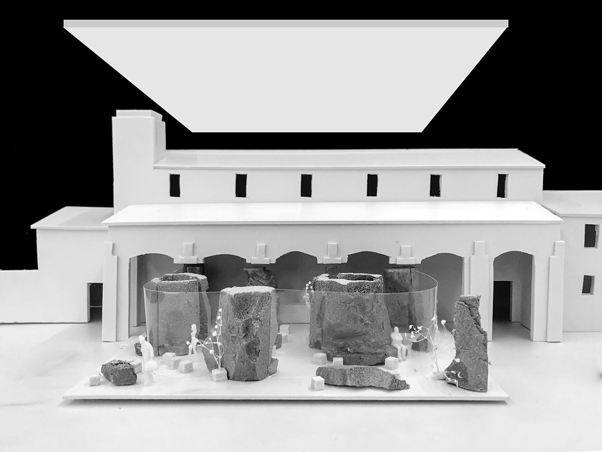 B.L.U.E. Architecture Studio adds a glazed cafe by using organic forms of stones to an open plaza