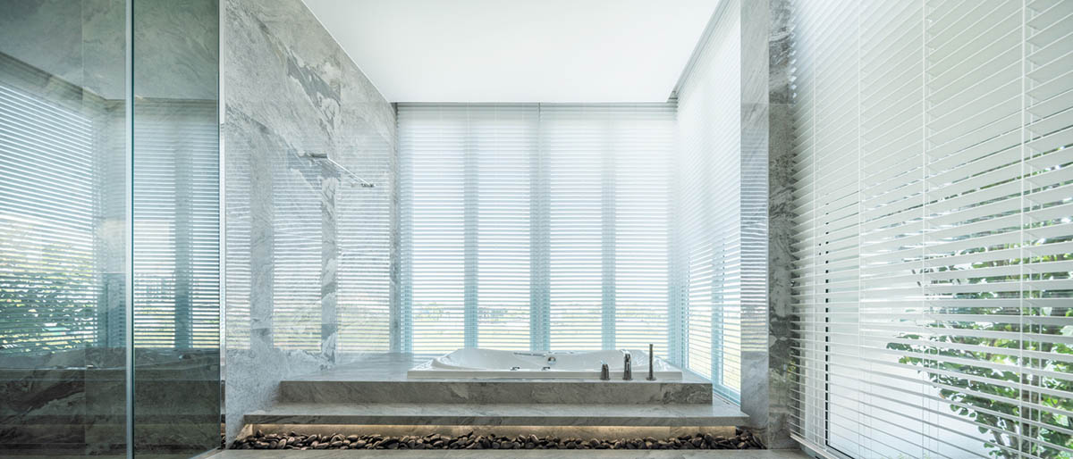 AAd built self-sustainable residence with perforated facade and steel rods in Thailand