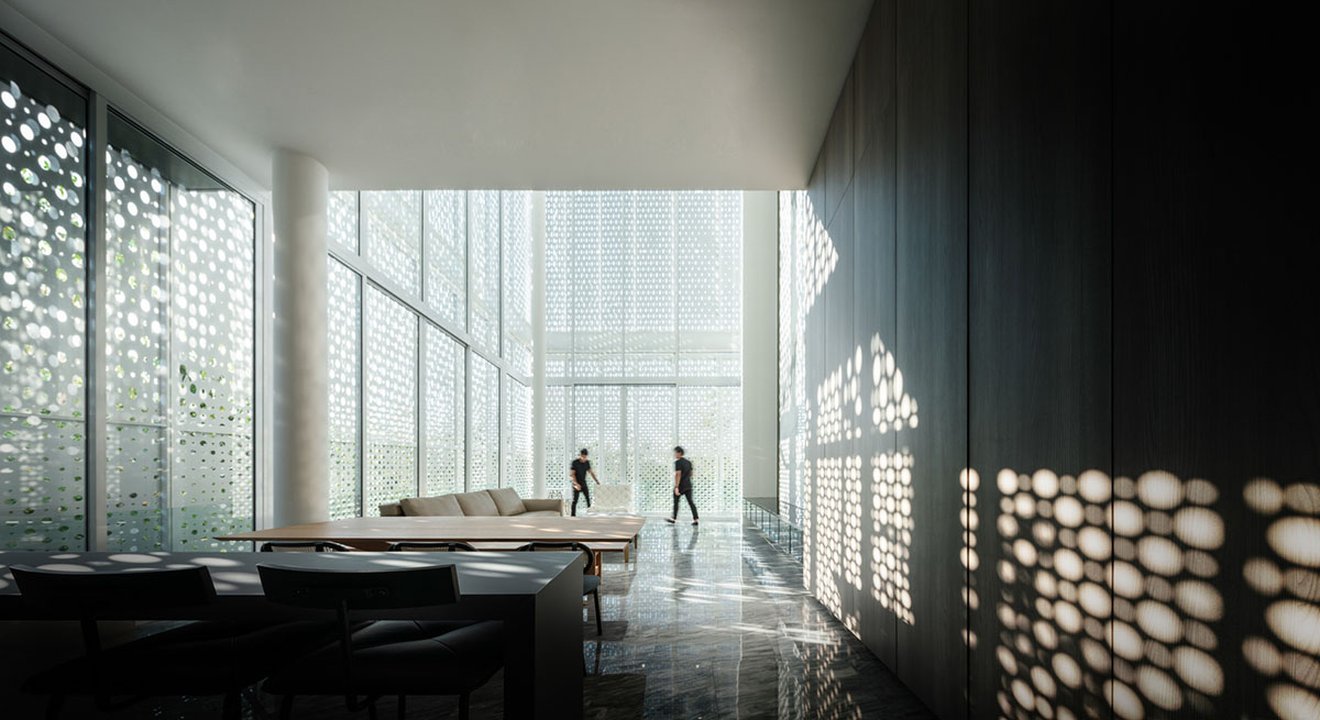 AAd built self-sustainable residence with perforated facade and steel rods in Thailand