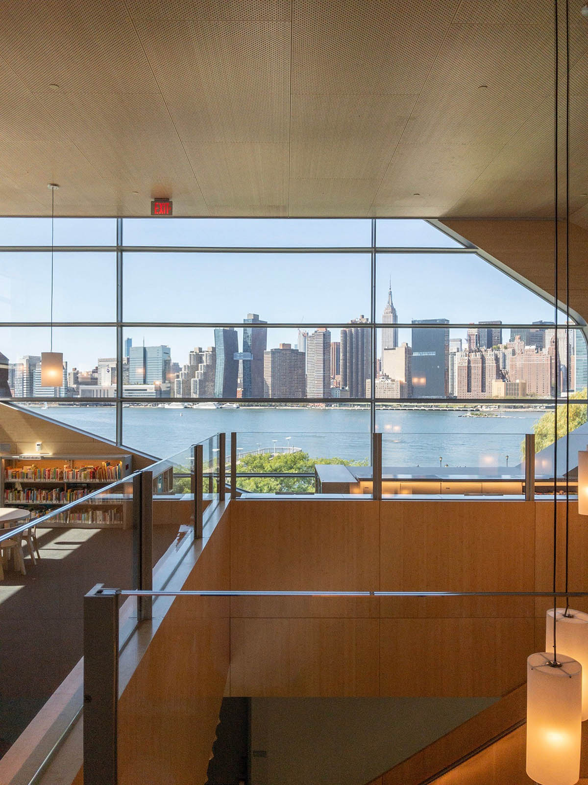 Steven Holl Architects completes Hunters Point Library with flowing sculpted cuts in New York