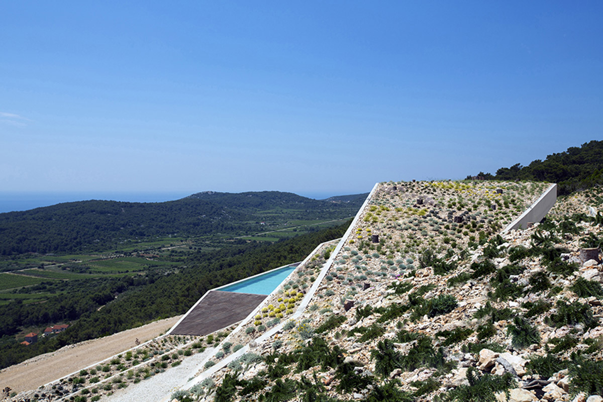 Proarh seamlessly blended this family house in the landscape on the Croatian island