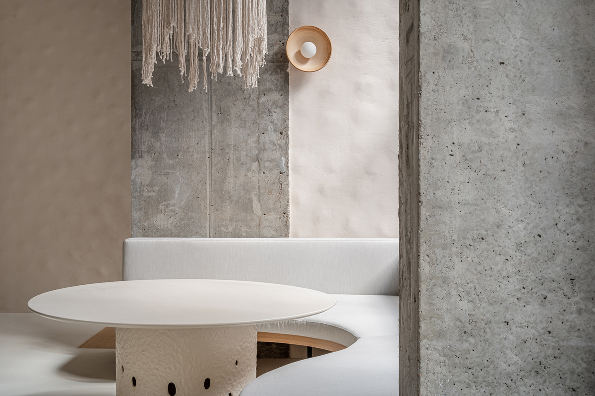 Earth-toned materials and soft lines form interiors of this ready-to-eat food restaurant in Kyiv