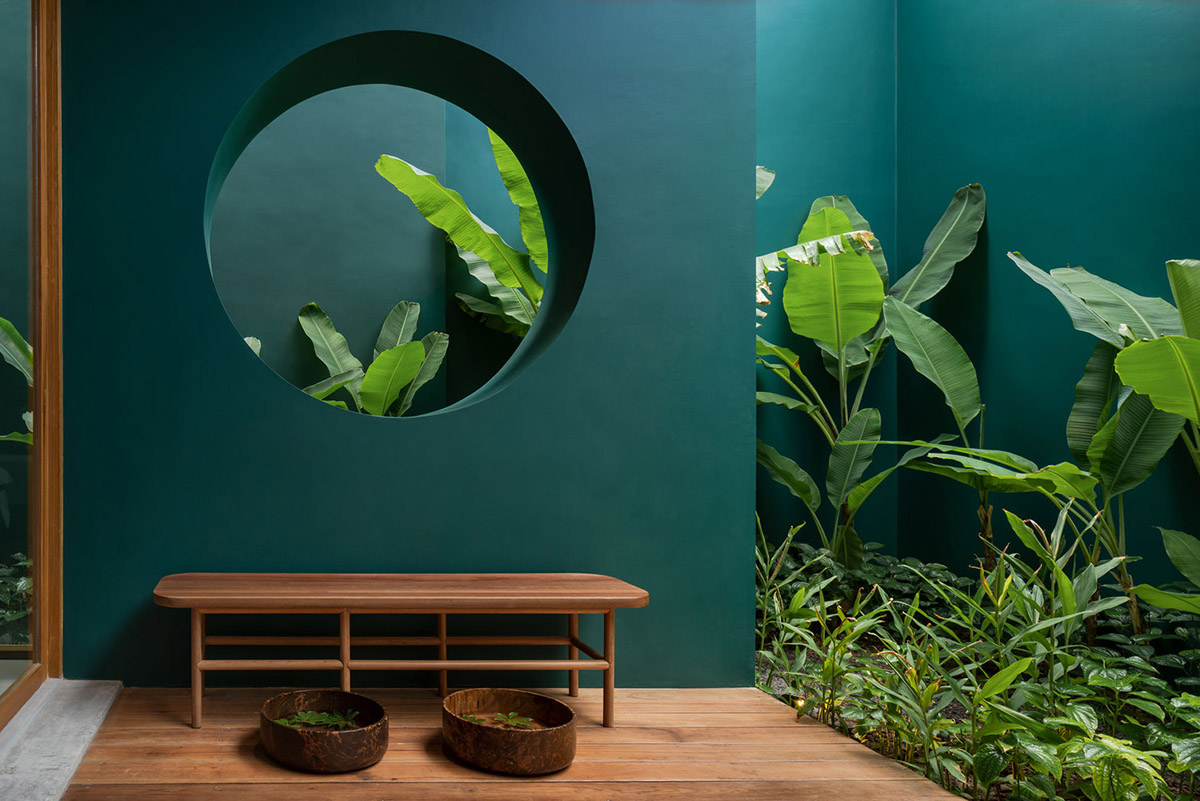 onion combines white concave and convex walls with colorful surfaces for beach resort in Thailand