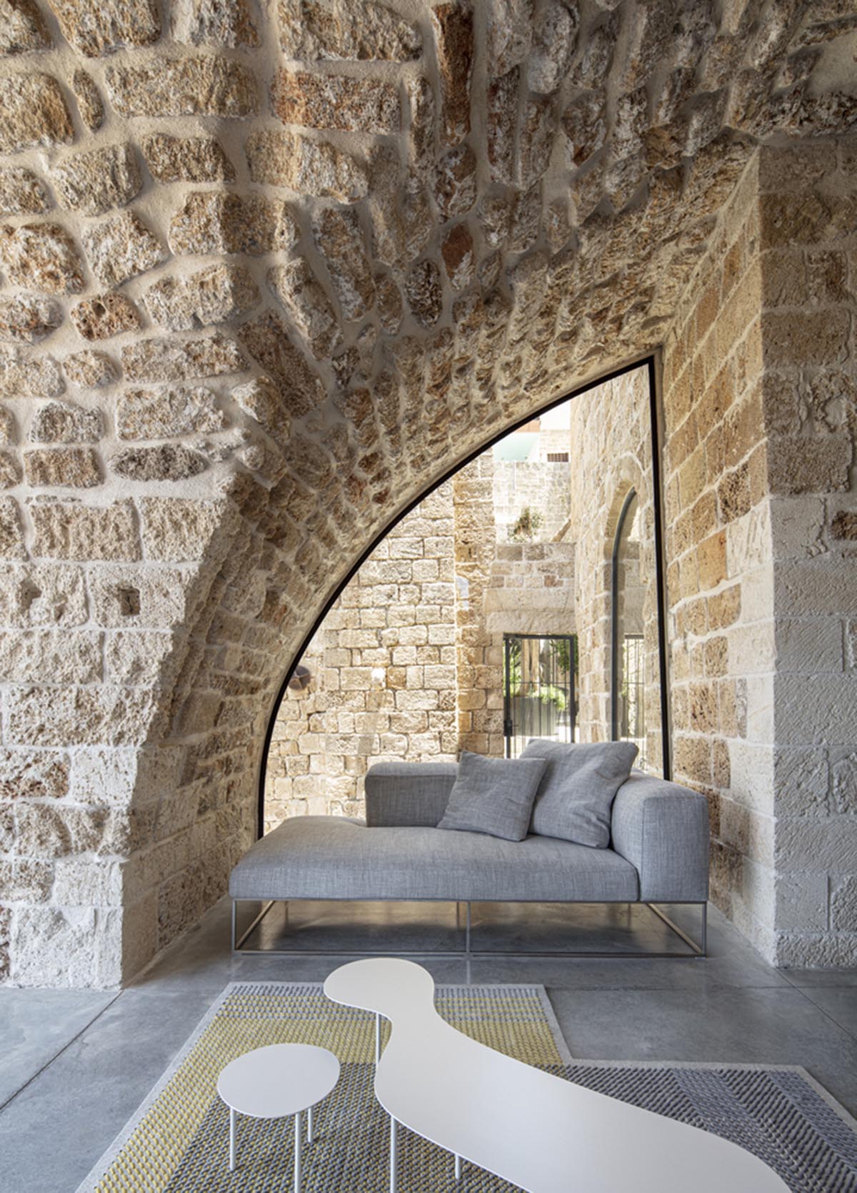Pitsou Kedem Architects creates interior with arched doorways in a historic apartment in Israel
