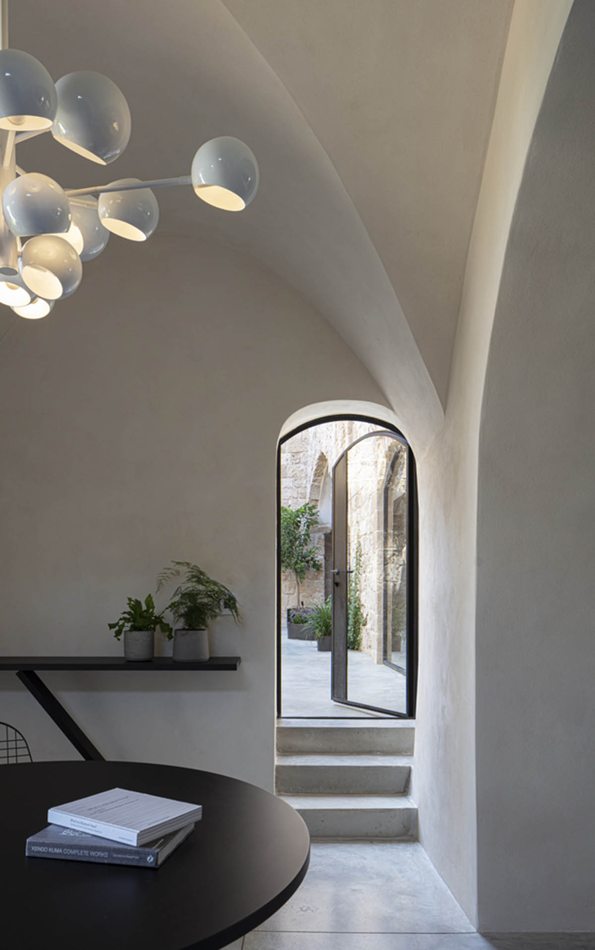 Pitsou Kedem Architects creates interior with arched doorways in a historic apartment in Israel