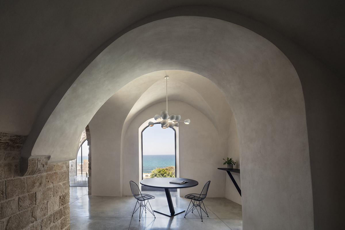 Pitsou Kedem Architects creates interior with arched doorways in a historic apartment in Israel