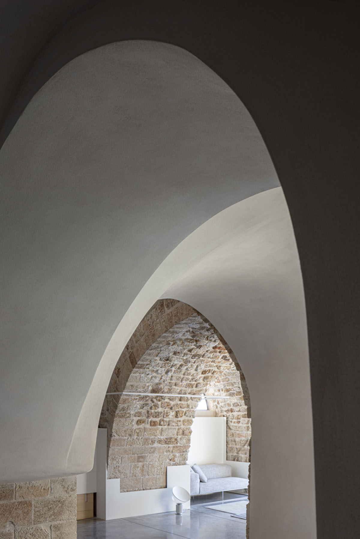 Pitsou Kedem Architects creates interior with arched doorways in a historic apartment in Israel
