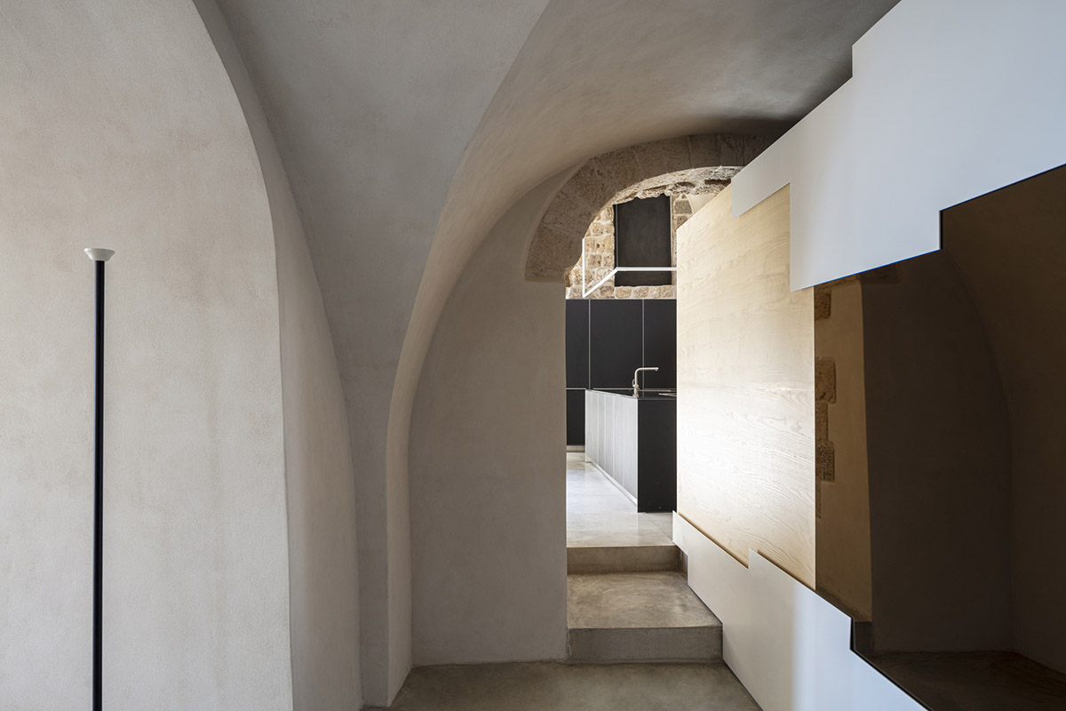 Pitsou Kedem Architects creates interior with arched doorways in a historic apartment in Israel