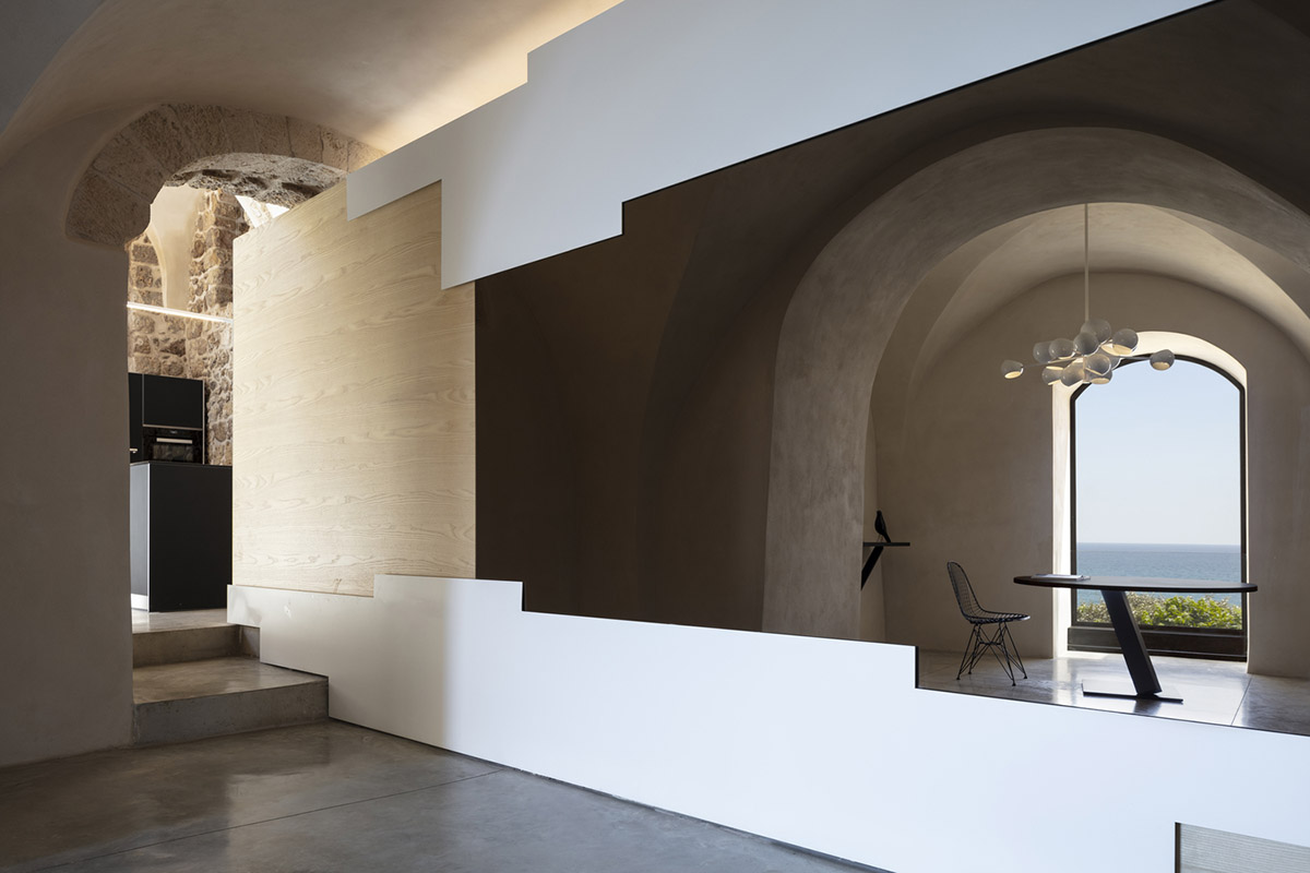 Pitsou Kedem Architects creates interior with arched doorways in a historic apartment in Israel