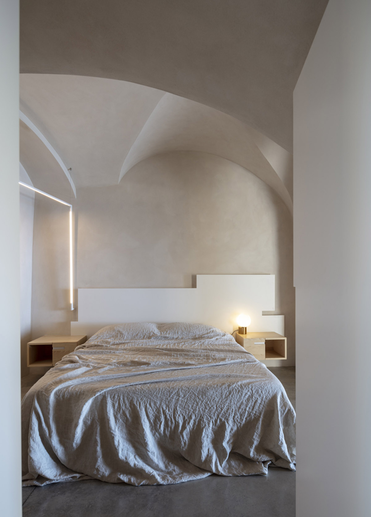 Pitsou Kedem Architects creates interior with arched doorways in a historic apartment in Israel