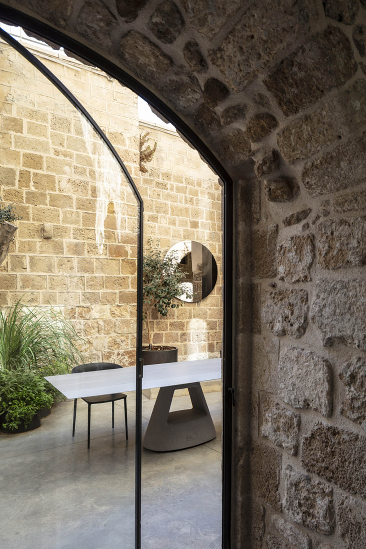Pitsou Kedem Architects creates interior with arched doorways in a historic apartment in Israel