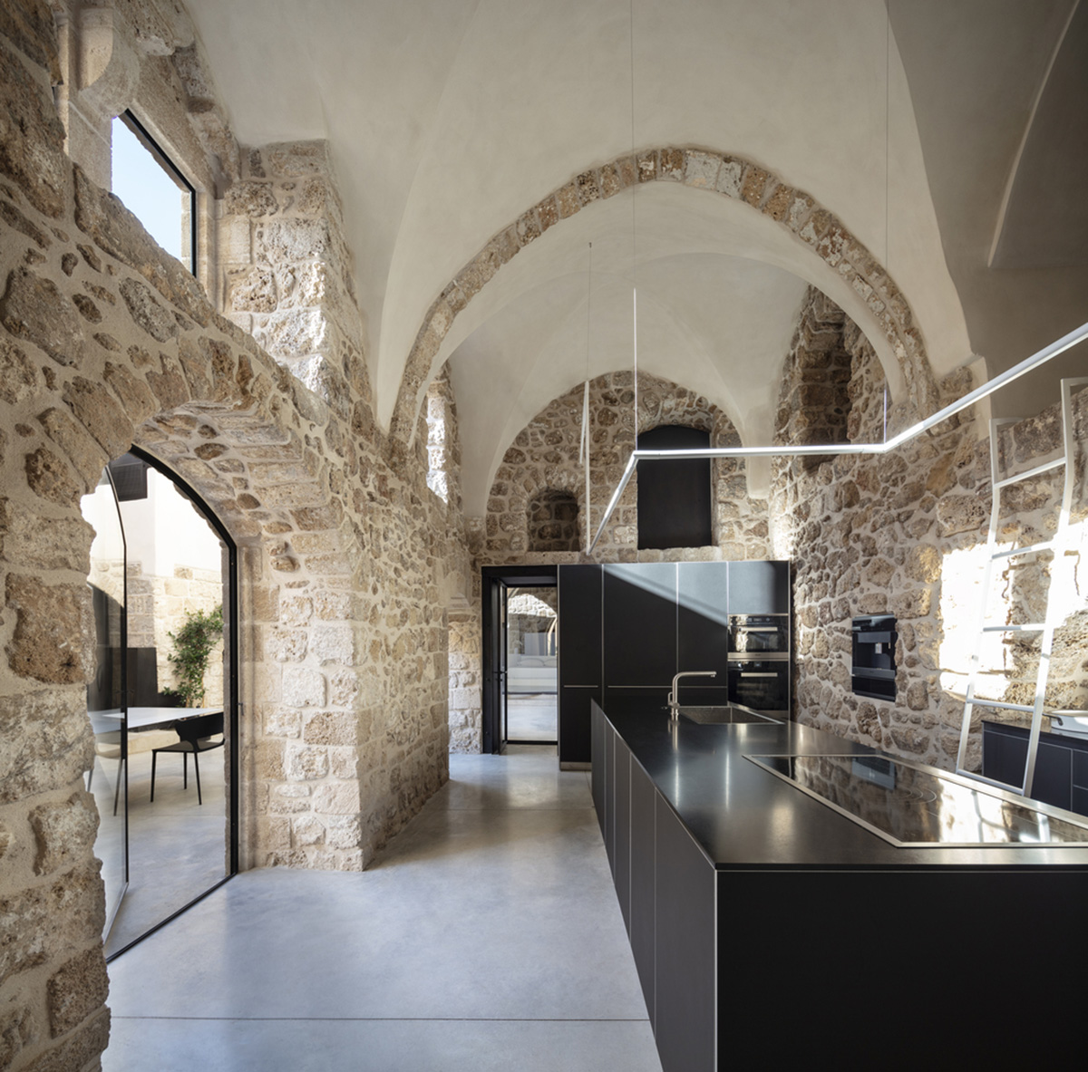 Pitsou Kedem Architects creates interior with arched doorways in a historic apartment in Israel