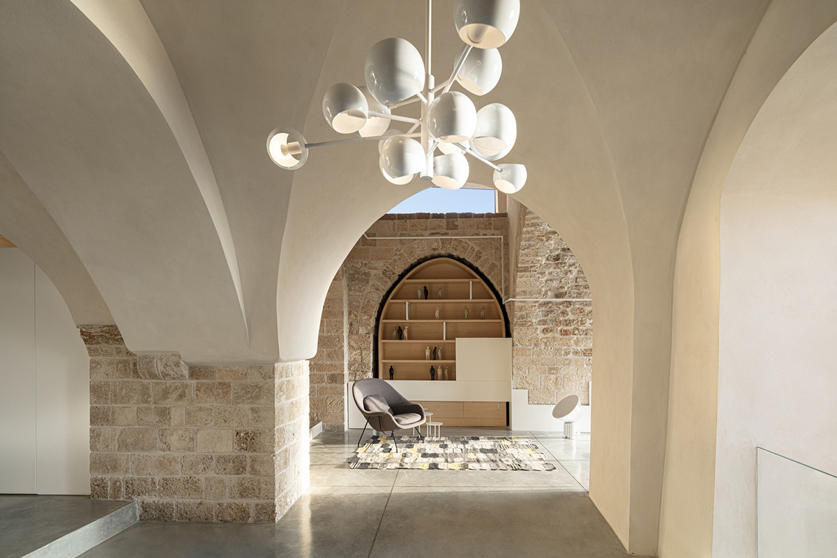 Pitsou Kedem Architects creates interior with arched doorways in a historic apartment in Israel