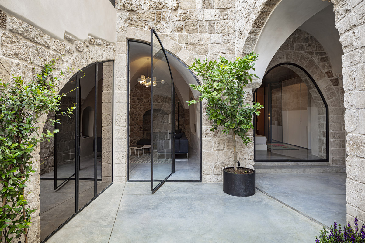 Pitsou Kedem Architects creates interior with arched doorways in a historic apartment in Israel