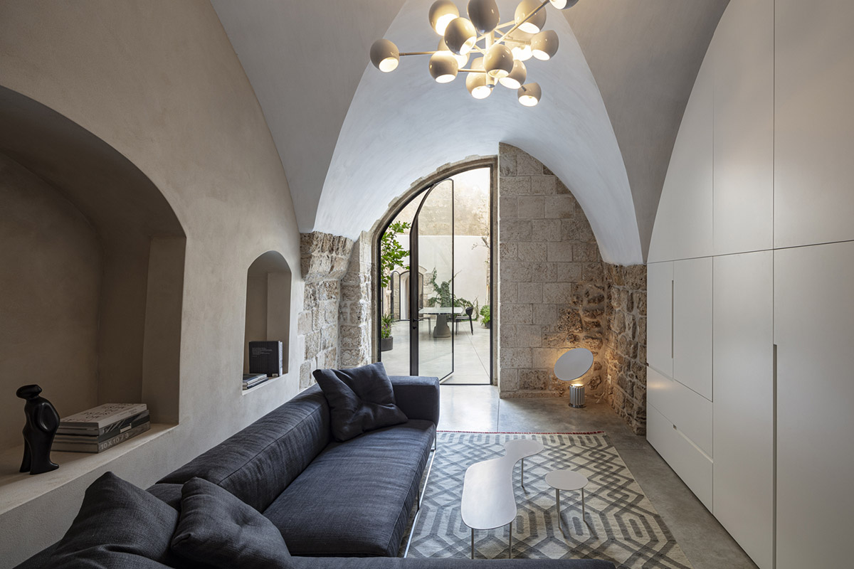 Pitsou Kedem Architects creates interior with arched doorways in a historic apartment in Israel