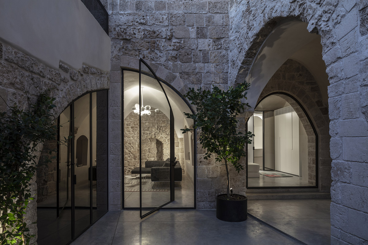 Pitsou Kedem Architects creates interior with arched doorways in a historic apartment in Israel