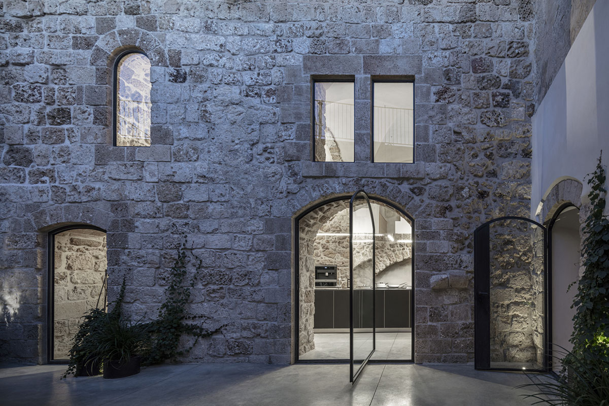 Pitsou Kedem Architects creates interior with arched doorways in a historic apartment in Israel
