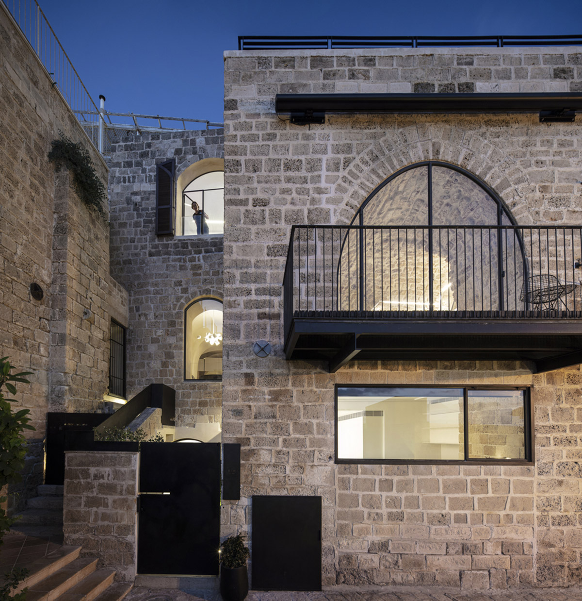 Pitsou Kedem Architects creates interior with arched doorways in a historic apartment in Israel