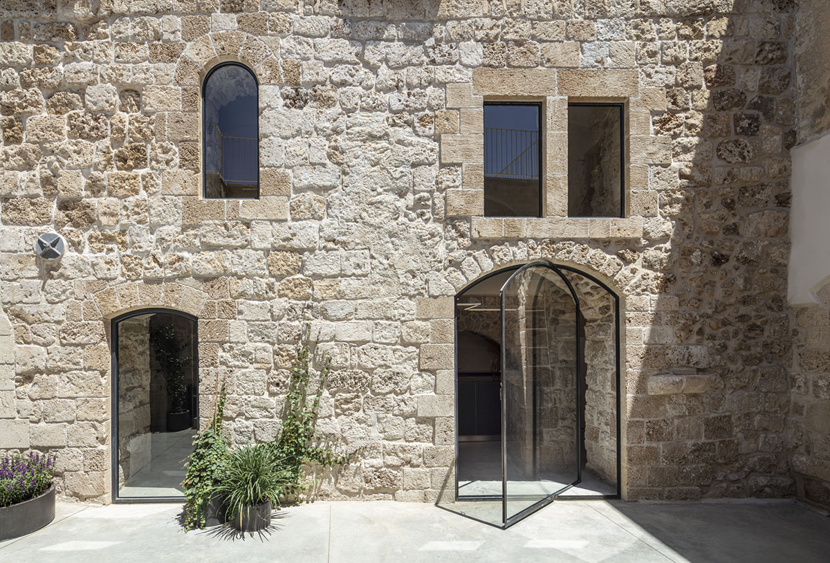 Pitsou Kedem Architects creates interior with arched doorways in a historic apartment in Israel