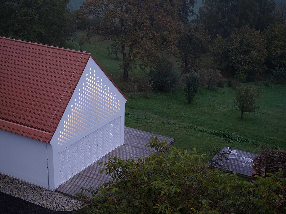 Jan Žaloudek Architekt converts a Baroque barn into a light-filled house with perforated gable wall