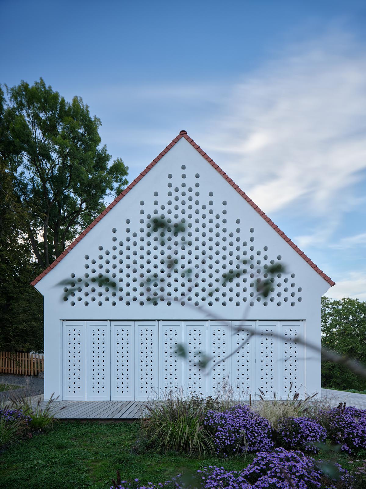 Jan Žaloudek Architekt converts a Baroque barn into a light-filled house with perforated gable wall