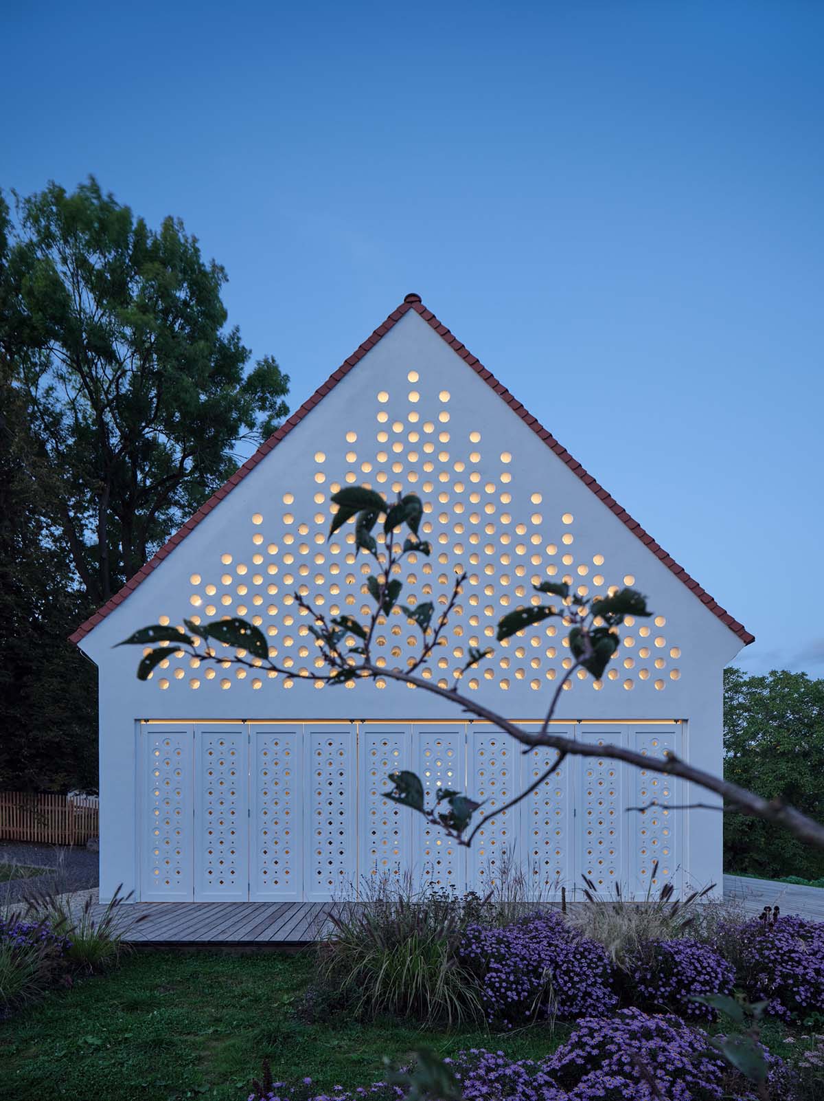 Jan Žaloudek Architekt converts a Baroque barn into a light-filled house with perforated gable wall