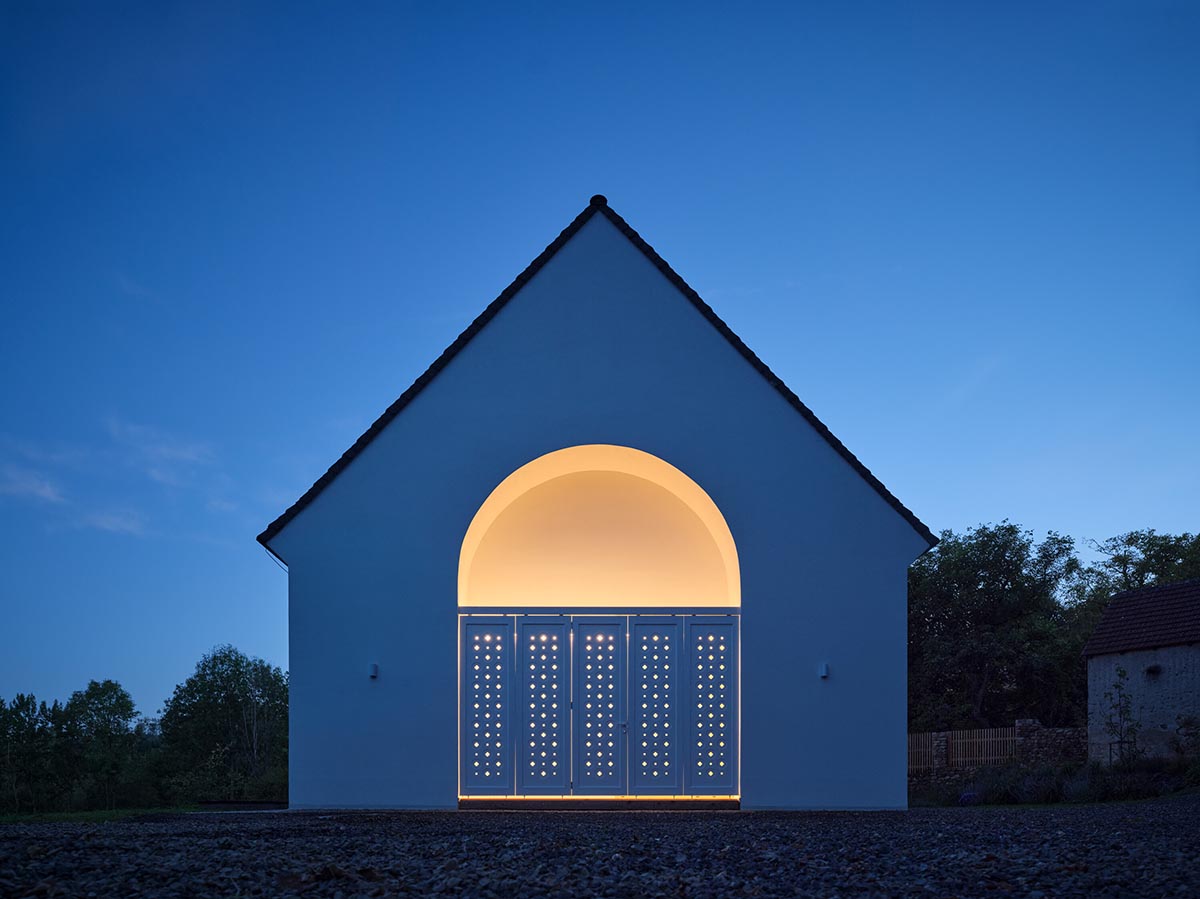 Jan Žaloudek Architekt converts a Baroque barn into a light-filled house with perforated gable wall