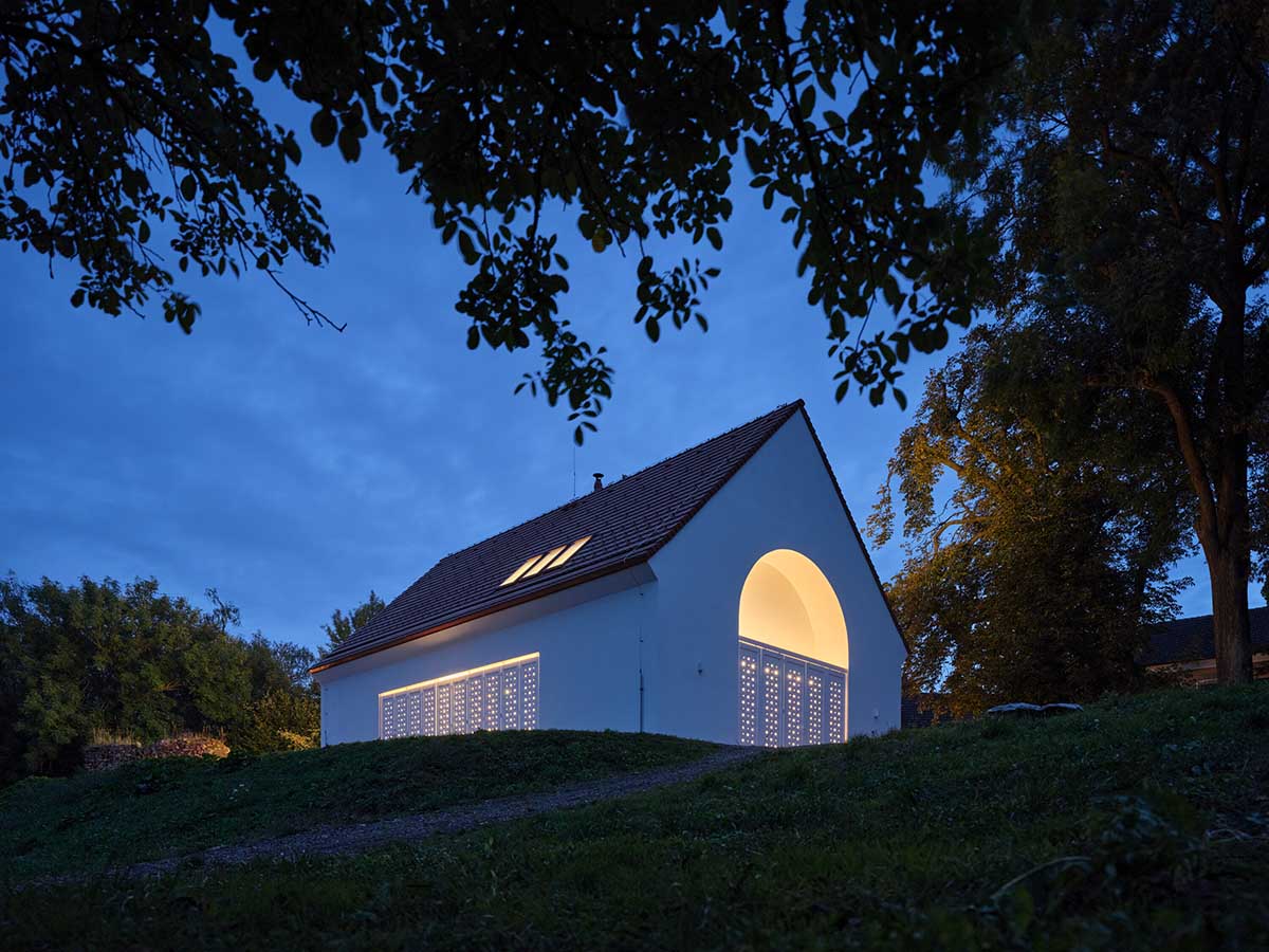 Jan Žaloudek Architekt converts a Baroque barn into a light-filled house with perforated gable wall
