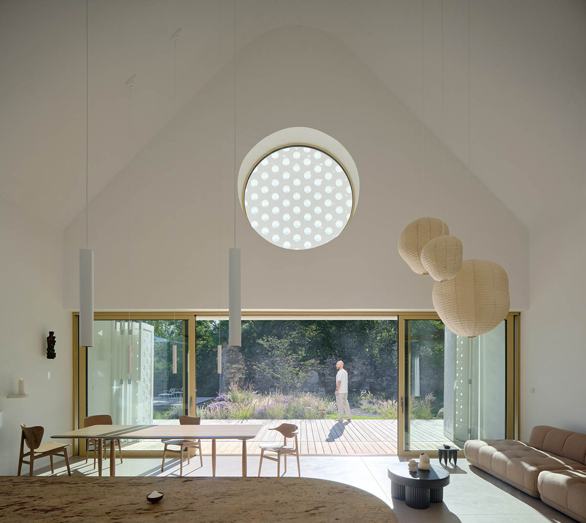 Jan Žaloudek Architekt converts a Baroque barn into a light-filled house with perforated gable wall