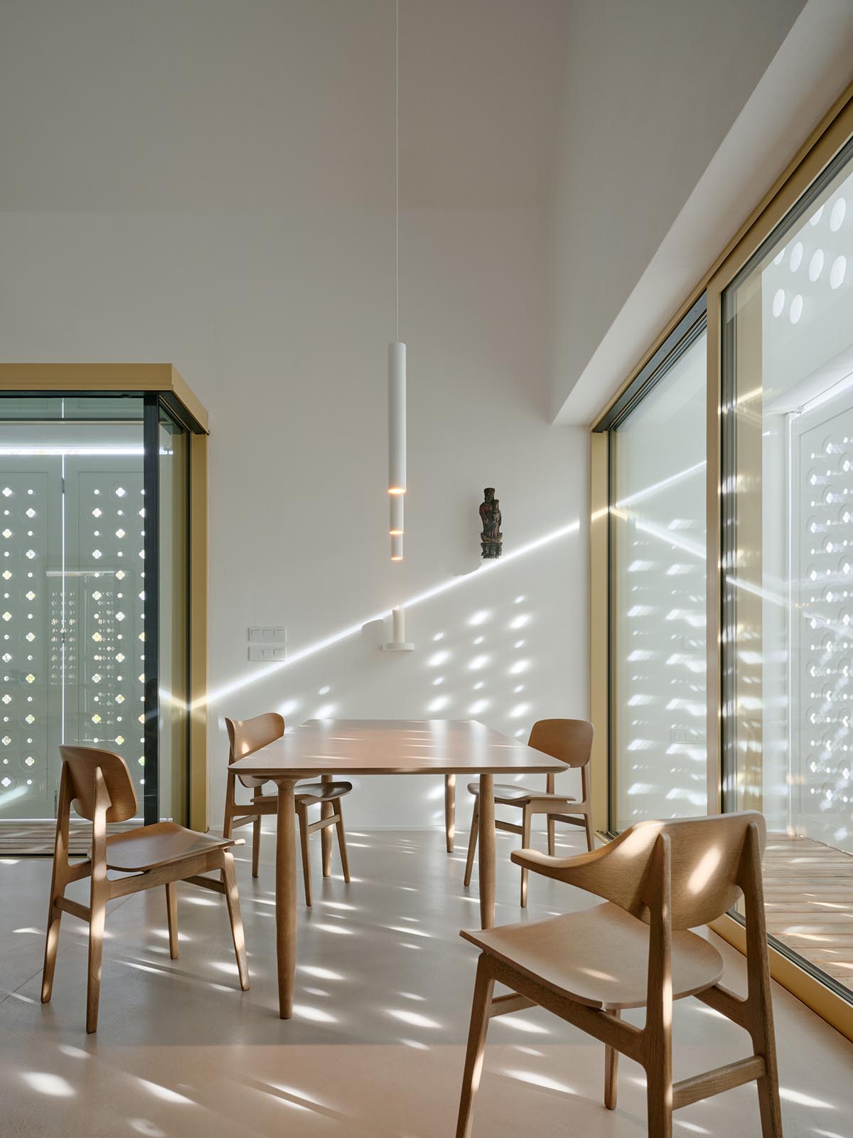 Jan Žaloudek Architekt converts a Baroque barn into a light-filled house with perforated gable wall