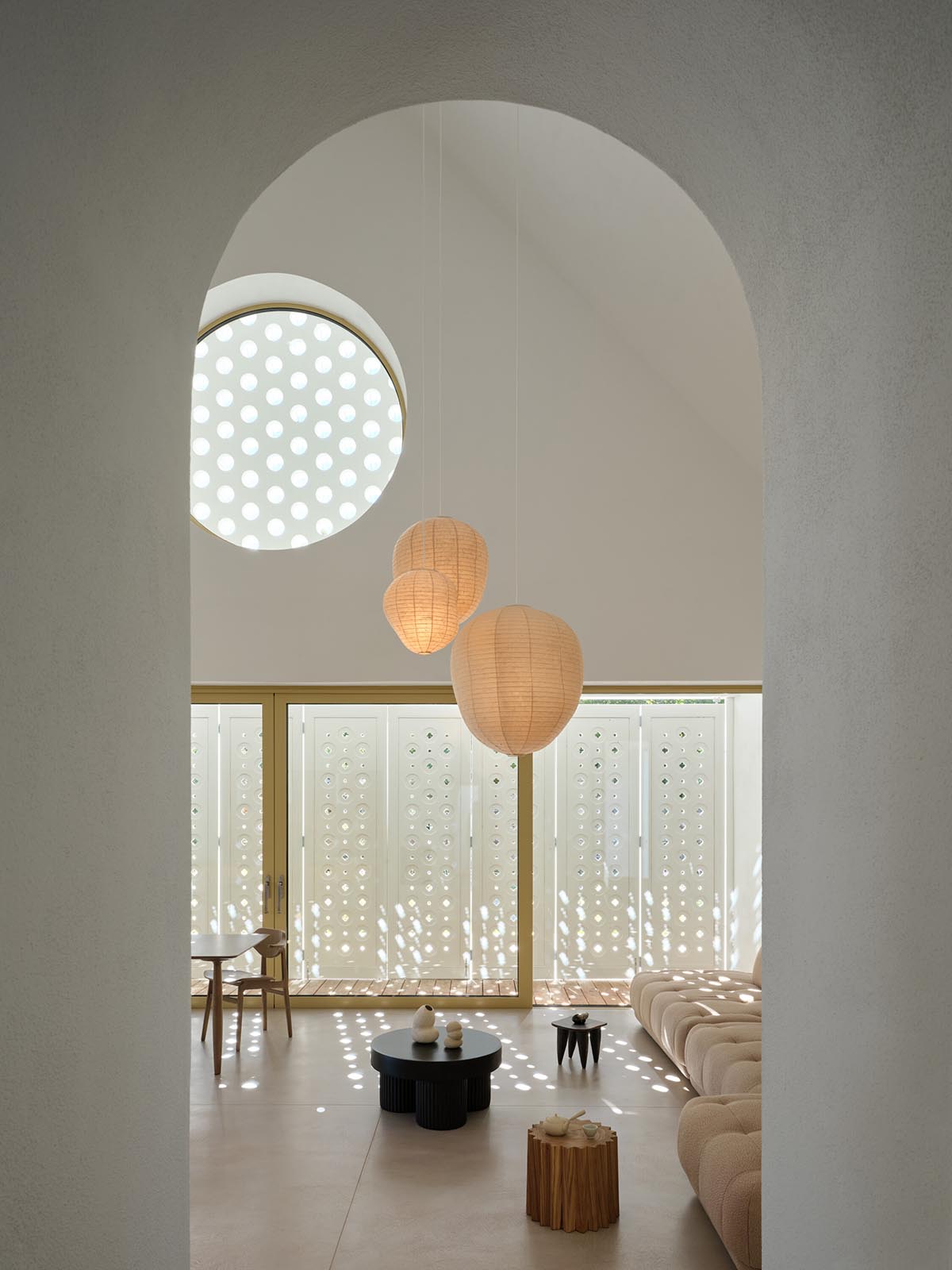 Jan Žaloudek Architekt converts a Baroque barn into a light-filled house with perforated gable wall