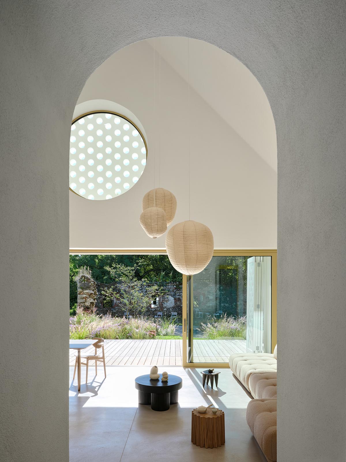 Jan Žaloudek Architekt converts a Baroque barn into a light-filled house with perforated gable wall