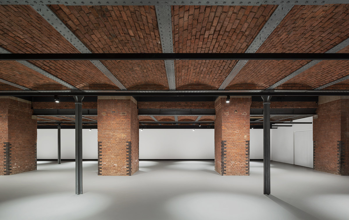 Carmody Groarke completes gallery that features brick vaulted ceilings and back-lit panels
