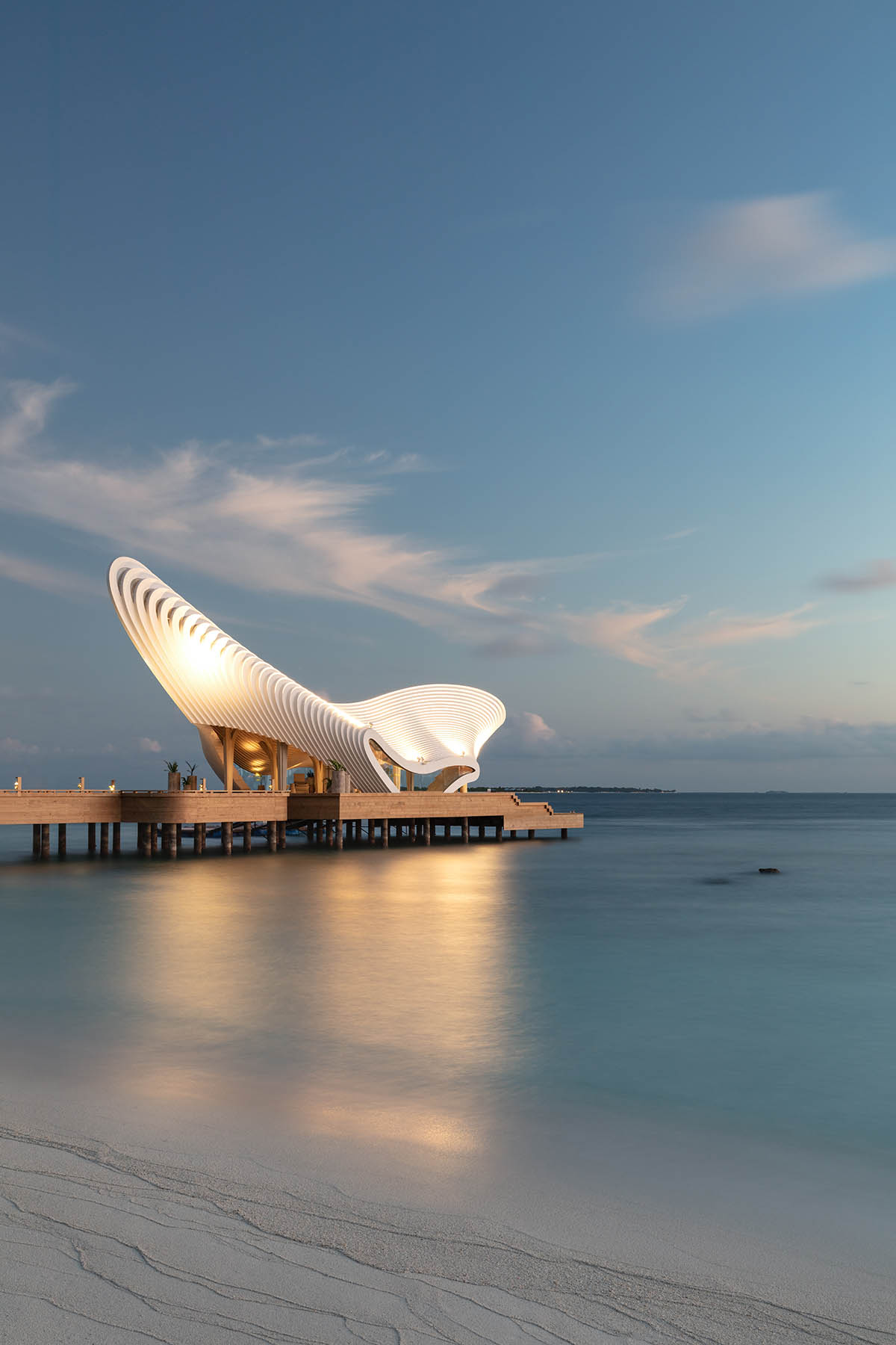 Se&ccedil;kin Pirim designs permanent sculpture inspired by the semazen&rsquo;s flared white skirt in Maldives