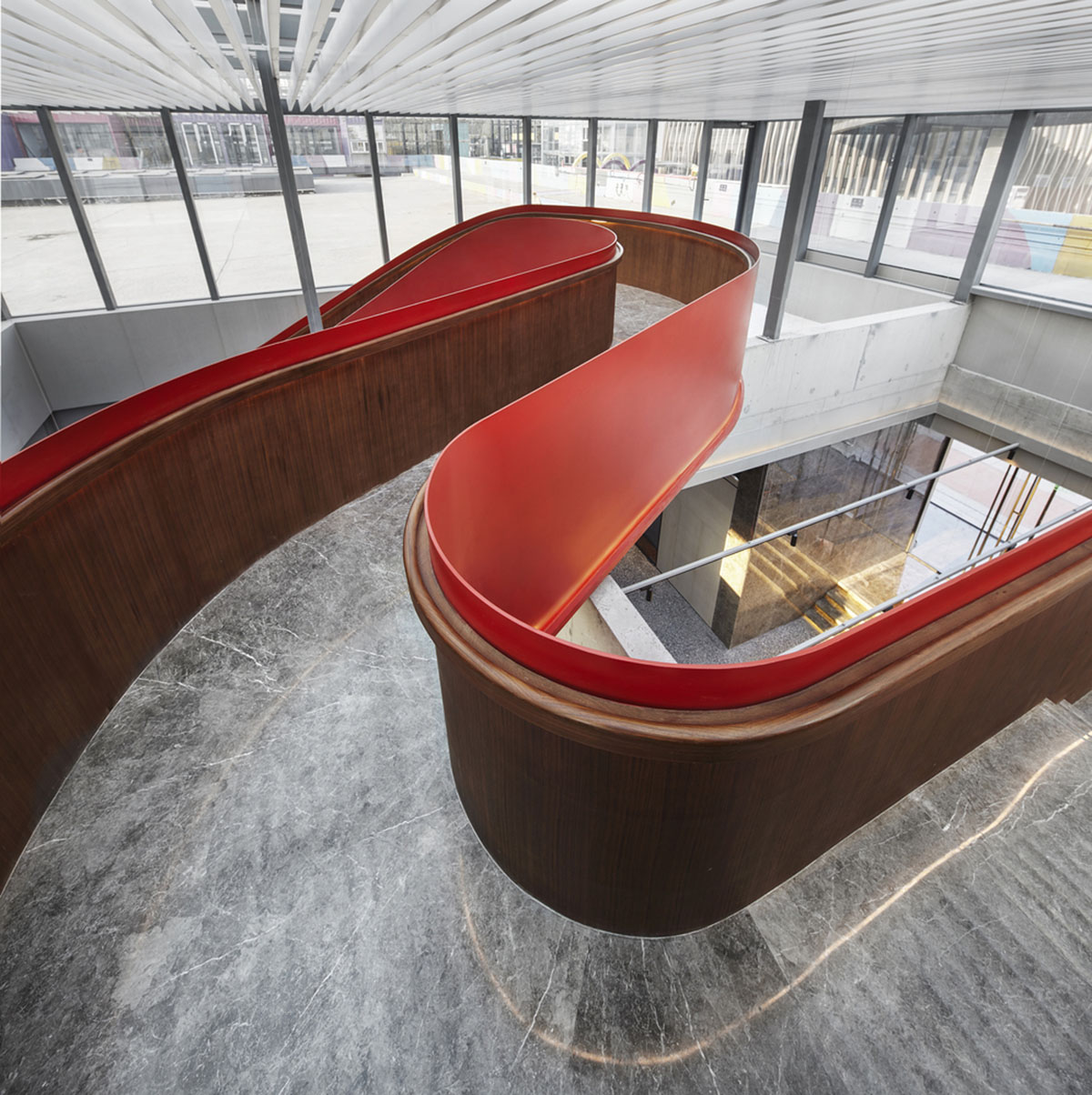 FUNUN LAB completes restaurant with ribbon-like red sculptural staircase in Beijing