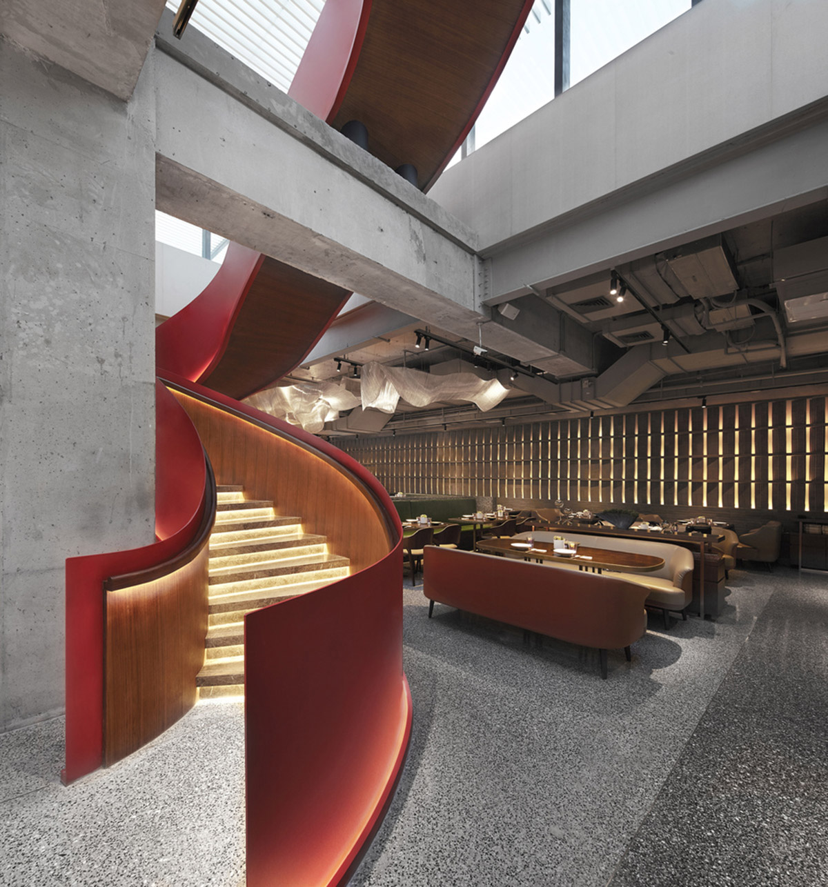 FUNUN LAB completes restaurant with ribbon-like red sculptural staircase in Beijing