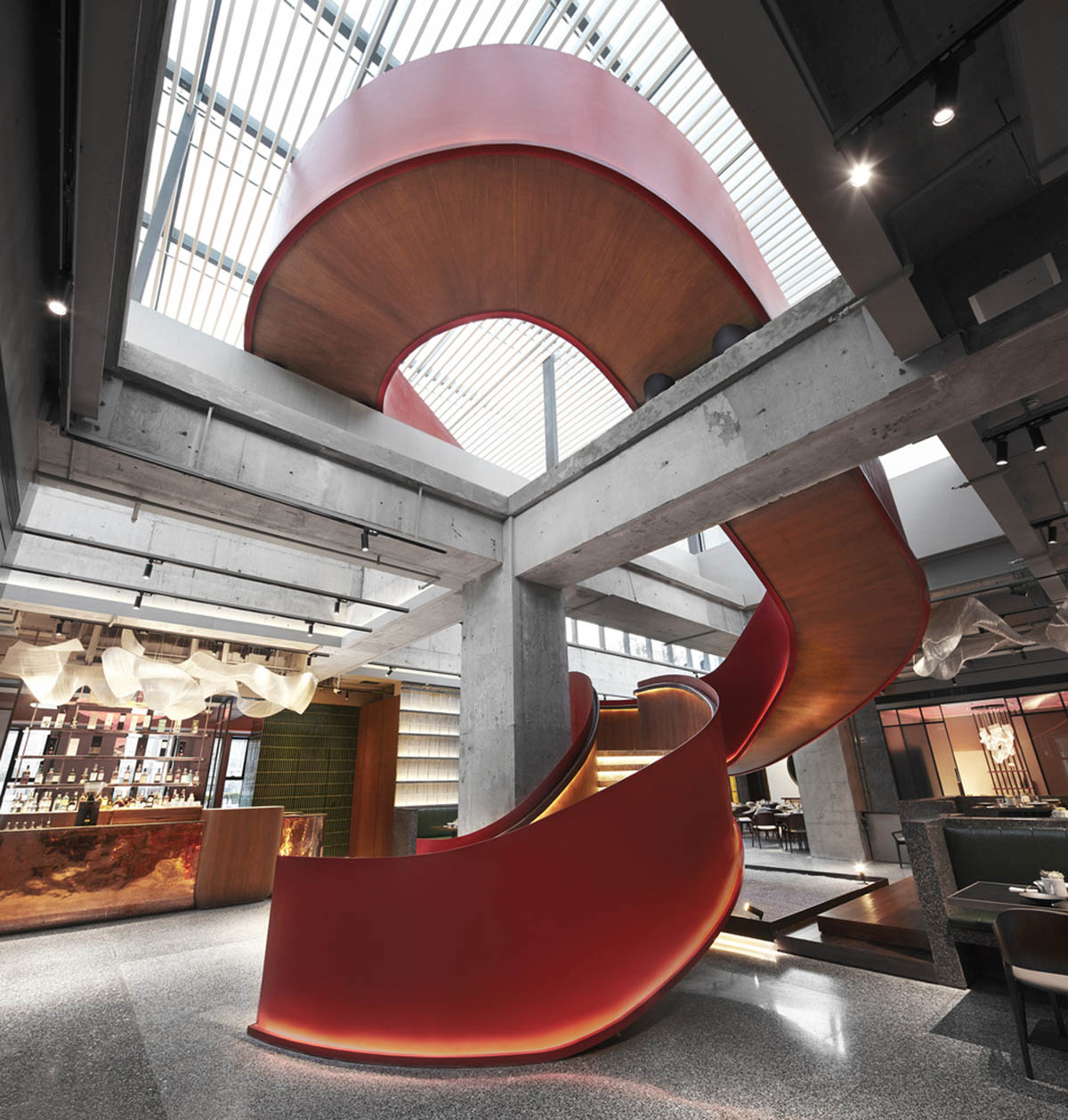 FUNUN LAB completes restaurant with ribbon-like red sculptural staircase in Beijing