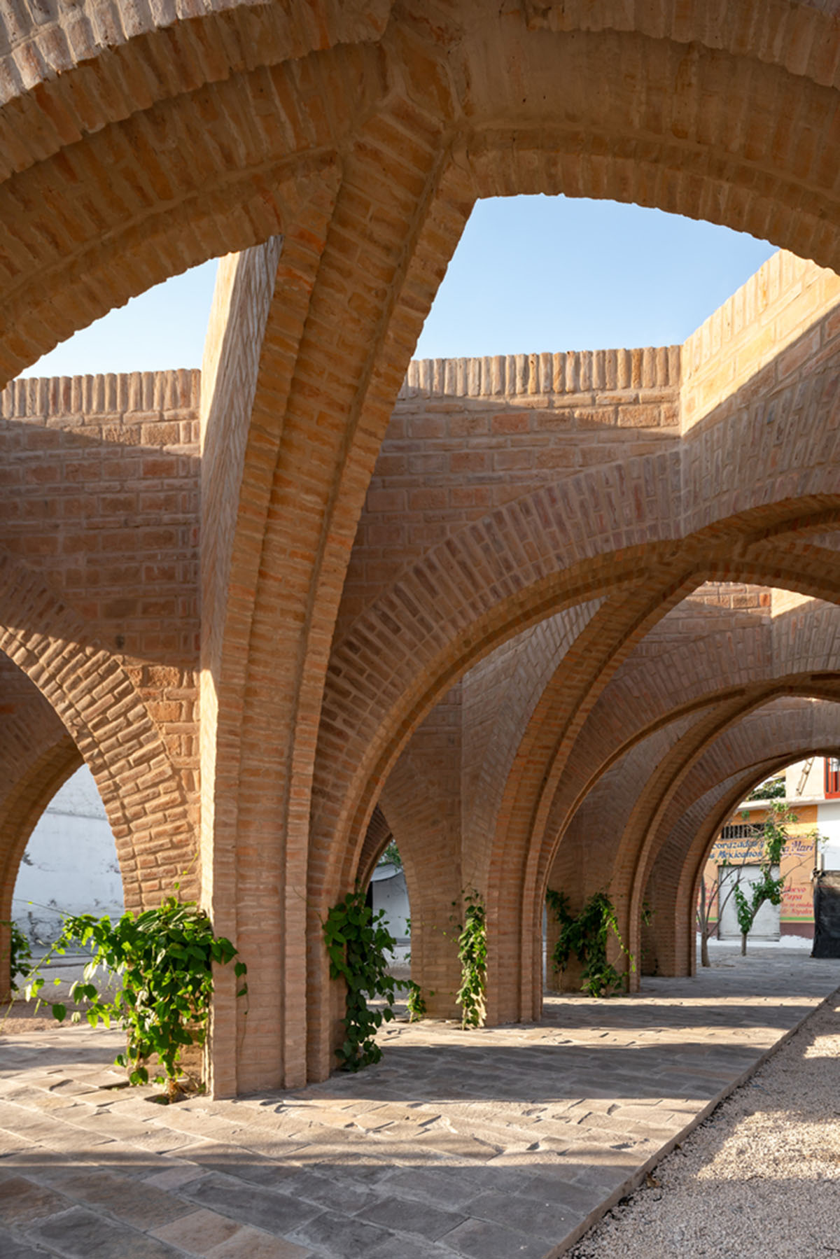 MMX revives public space with monolithic brick arcades in Jojutla, Mexico