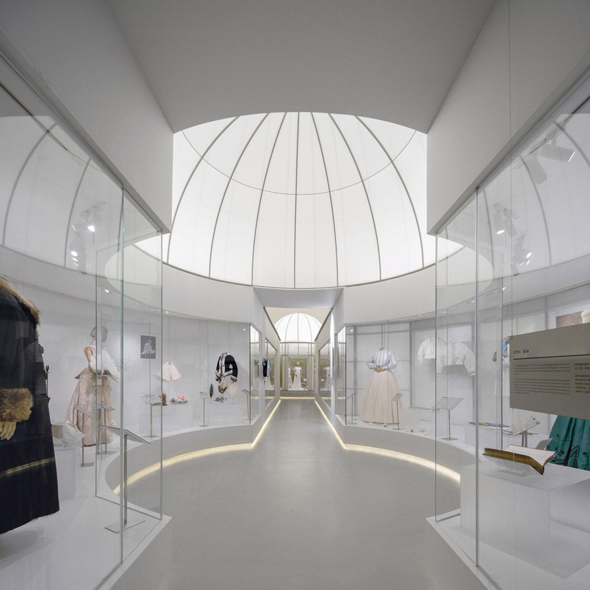 Studio 10 designs exhibition space with white tubular structures and black translucent ramps in China