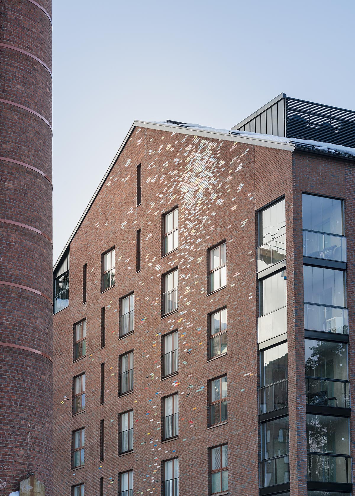JKMM Architects completes new housing featuring colorful brick patterns on facade in Finland