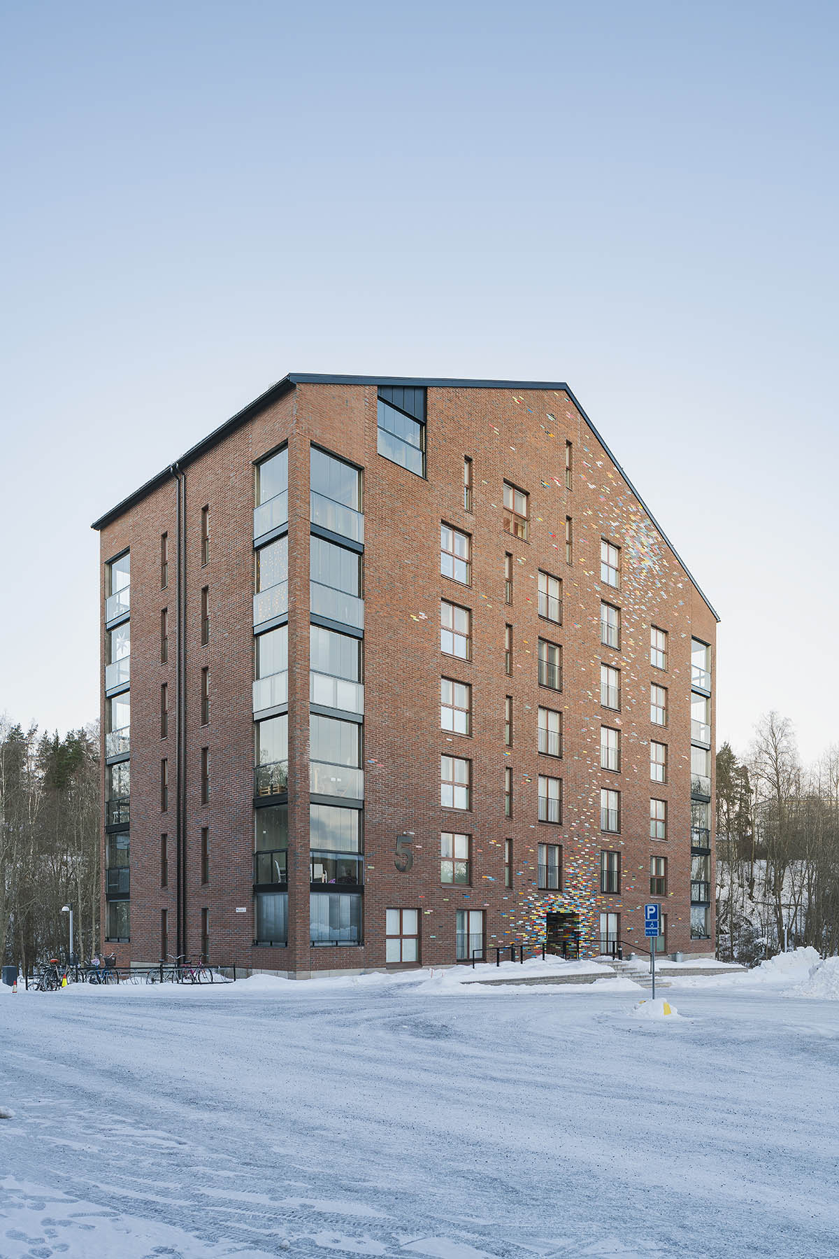 JKMM Architects completes new housing featuring colorful brick patterns on facade in Finland