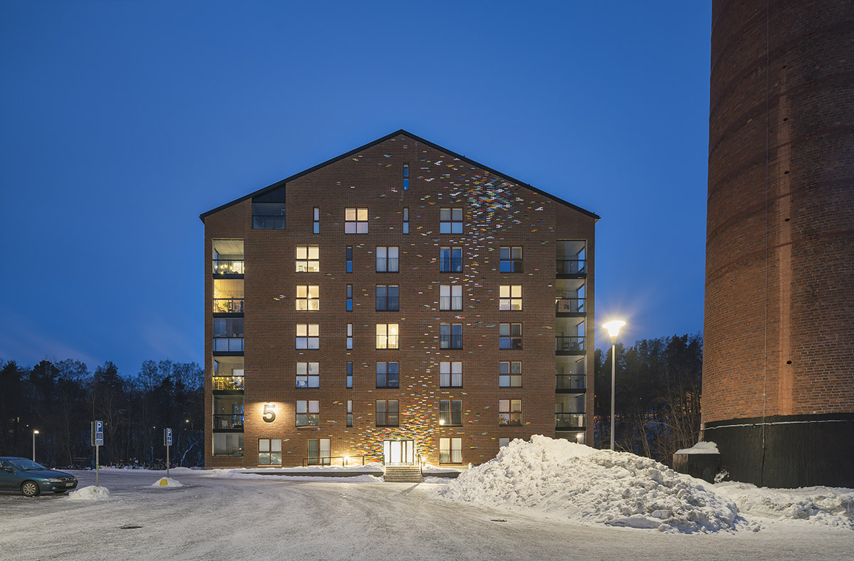 JKMM Architects completes new housing featuring colorful brick patterns on facade in Finland
