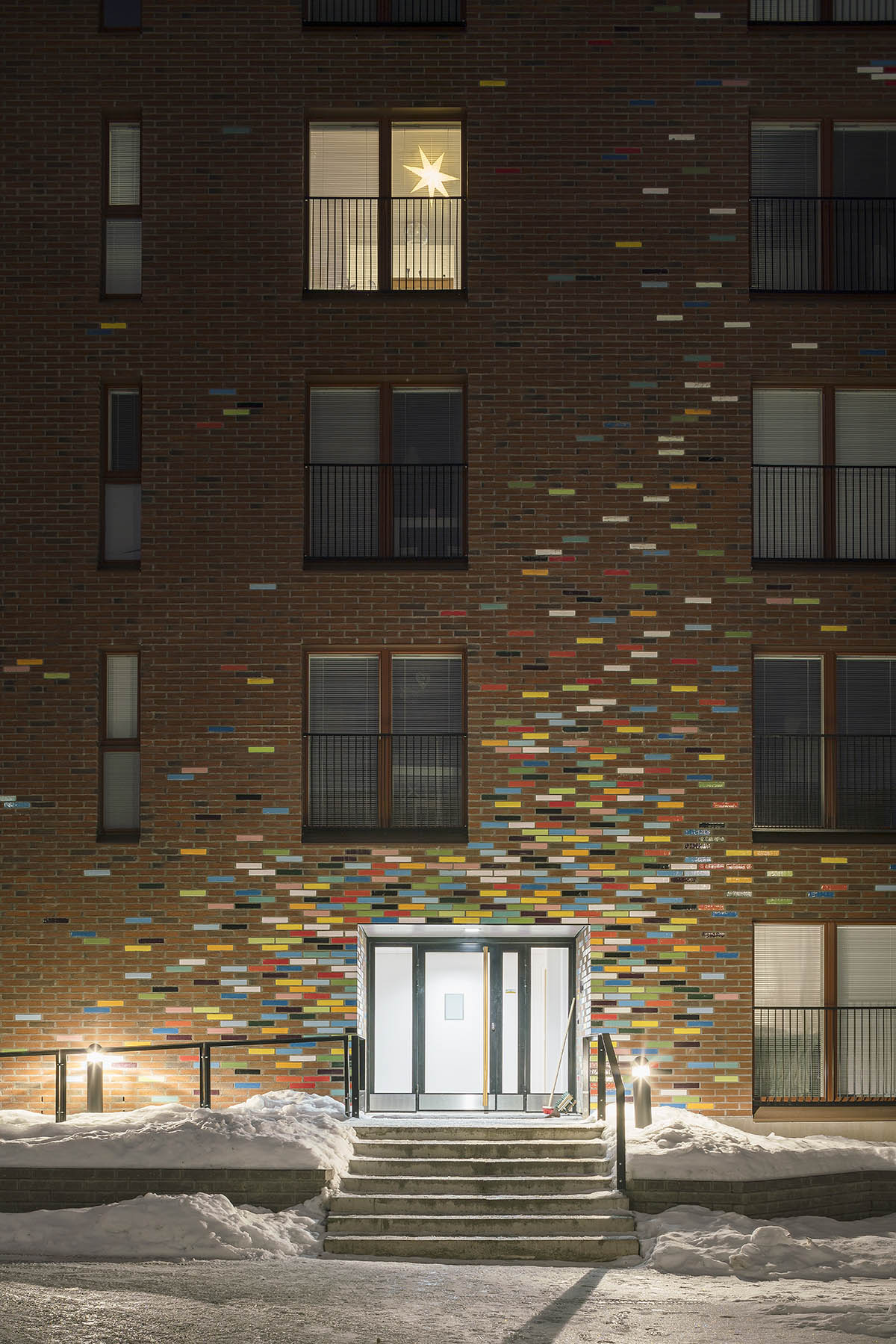JKMM Architects completes new housing featuring colorful brick patterns on facade in Finland