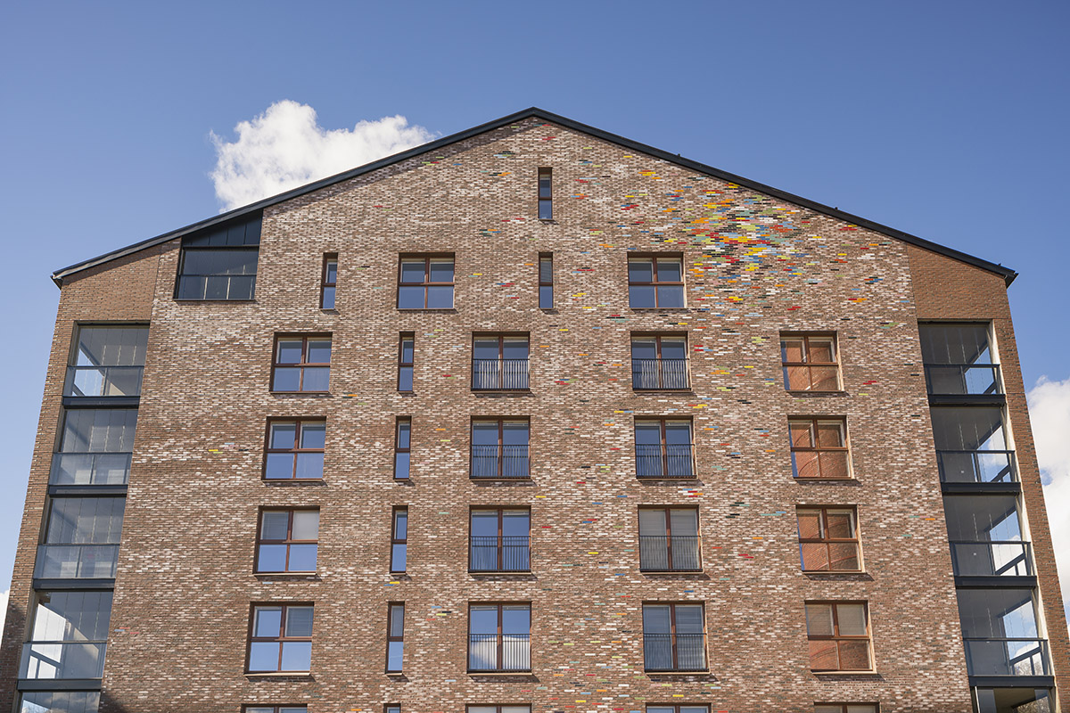 JKMM Architects completes new housing featuring colorful brick patterns on facade in Finland