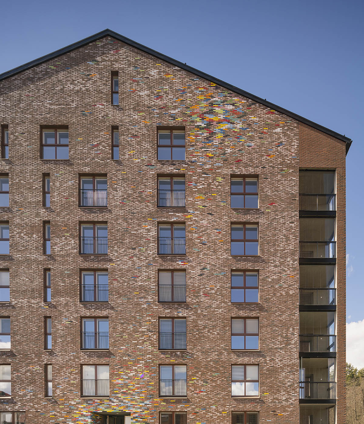 JKMM Architects completes new housing featuring colorful brick patterns on facade in Finland