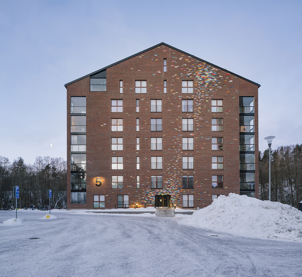 JKMM Architects completes new housing featuring colorful brick patterns on facade in Finland