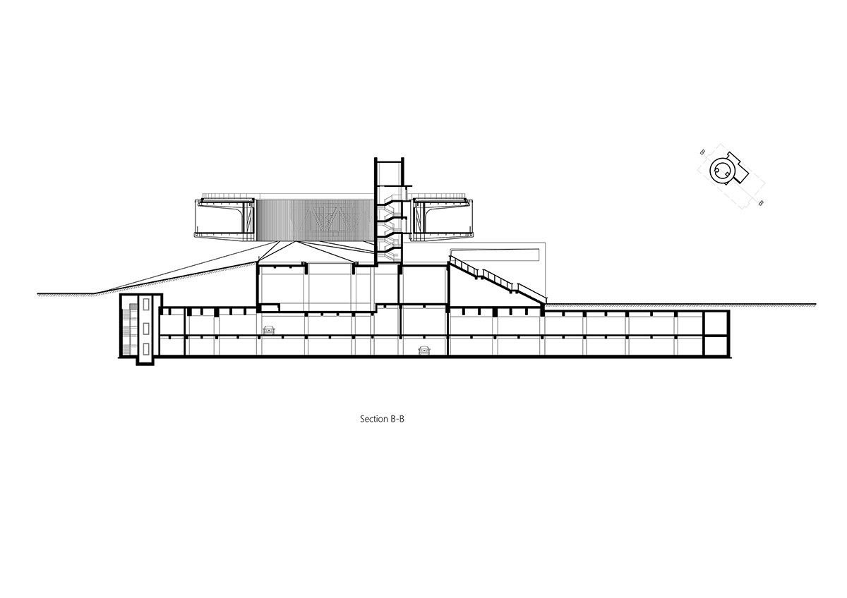 STUDIO A+ designs climbable ring-shaped art center on a green mound in Zhengzhou
