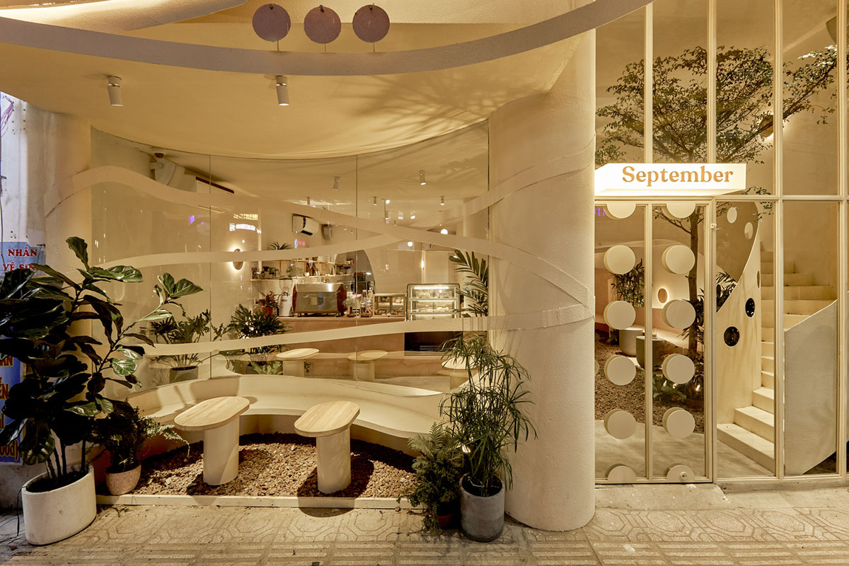September Cafe is designed to look like a bird's nest with curved steel stripes in Vietnam